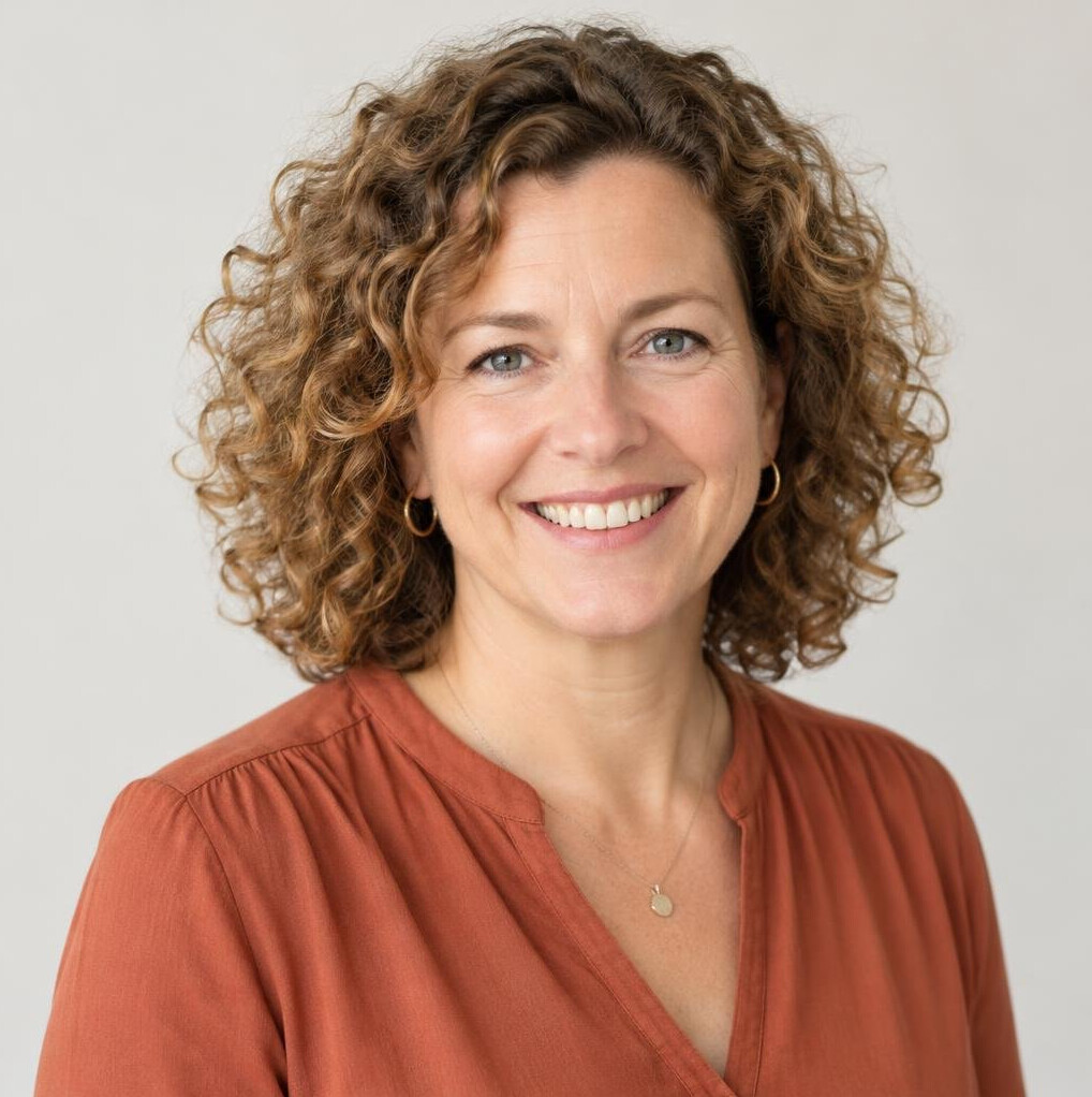 Portrait of a cheerful German woman community coordinator in her late forties with curly hair