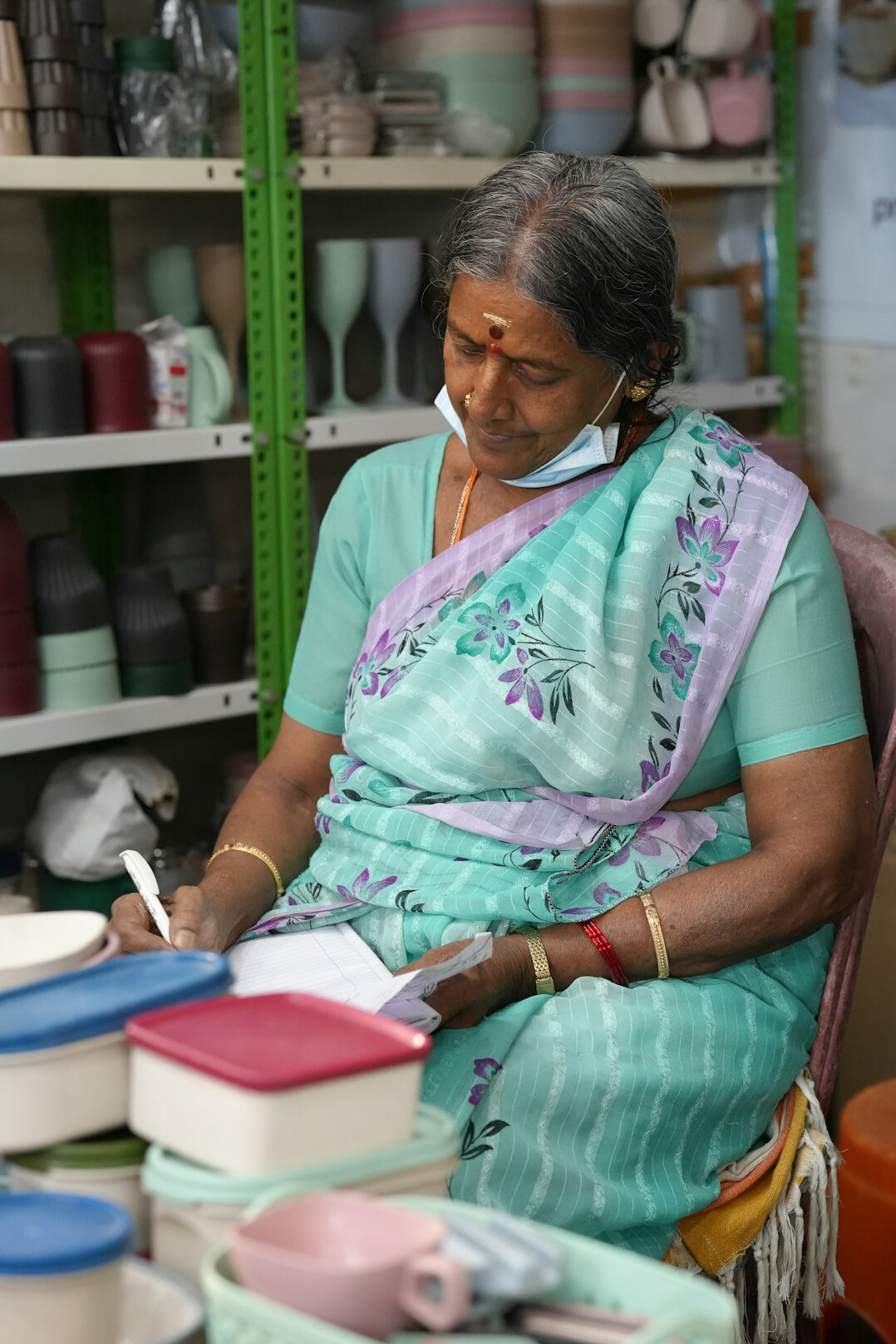 Senior woman writing in a journal during a creative workshop